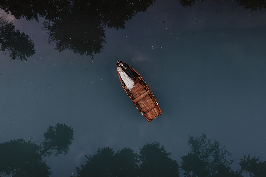 A small wooden boat floating in the water.